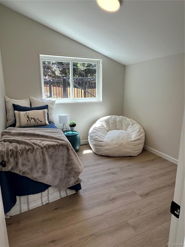 9540 King Way, Westminster, CO 80031 - bedroom featuring vaulted ceiling and wood finished floors