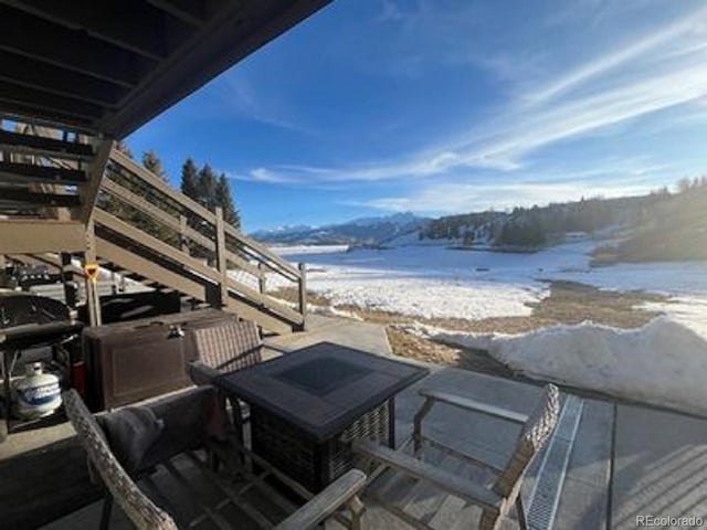 exterior space featuring a water view and a beach view