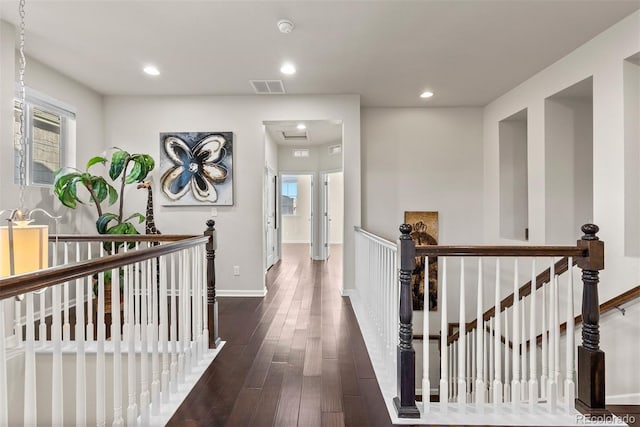 hallway featuring dark hardwood / wood-style flooring