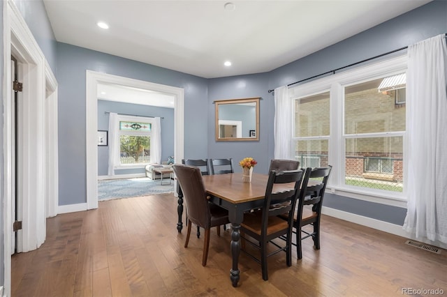 dining space featuring hardwood / wood-style floors