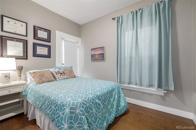 bedroom featuring dark hardwood / wood-style flooring