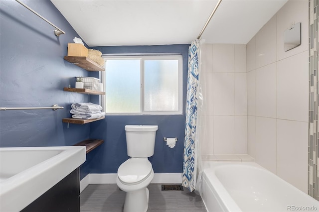 bathroom with shower / bath combination with curtain and toilet