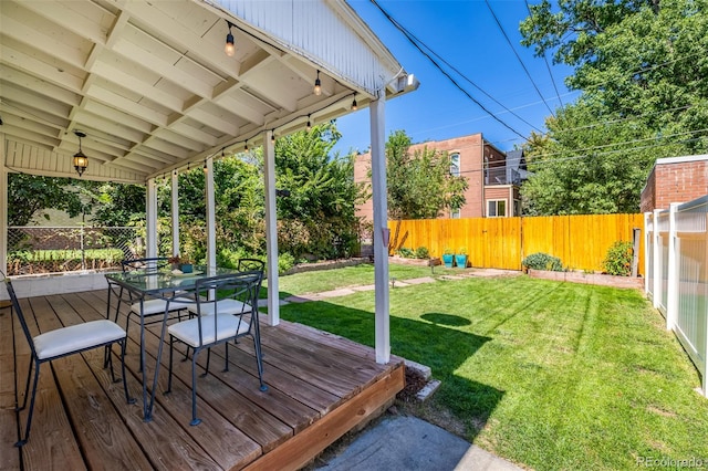 deck featuring a lawn