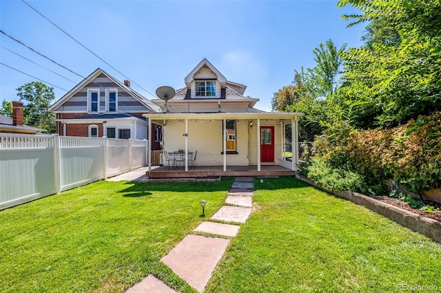 bungalow-style home featuring a front yard and covered porch