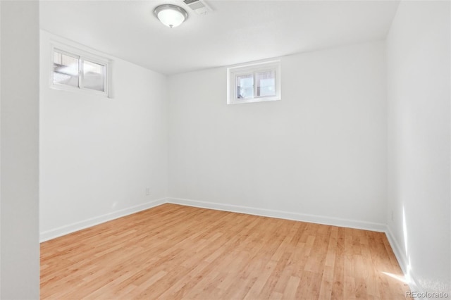 7180 Zuni St, Denver, CO 80221 - basement featuring visible vents, baseboards, and wood finished floors