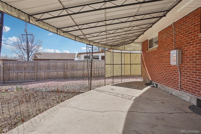 7180 Zuni St, Denver, CO 80221 - view of patio with an attached carport and fence