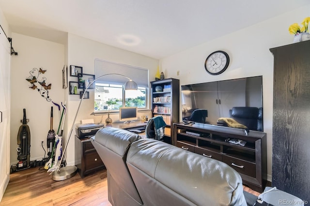 5757 S Algonquian Way Unit E, Aurora, CO 80016 - living area featuring light wood-type flooring and a desk