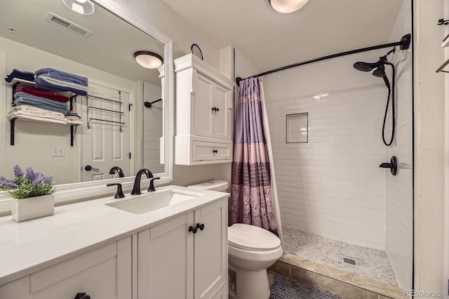 5757 S Algonquian Way Unit E, Aurora, CO 80016 - bathroom featuring vanity and a tile shower