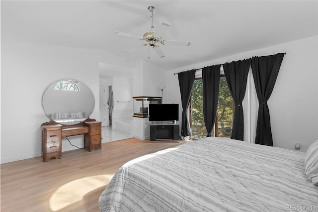 bedroom with lofted ceiling, ceiling fan, and wood finished floors