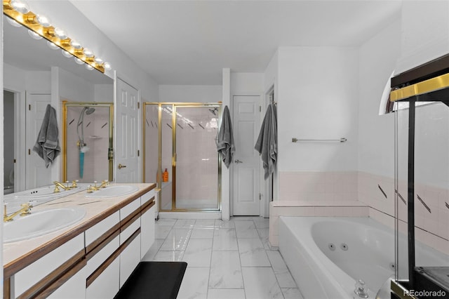 full bathroom with marble finish floor, a shower stall, a tub with jets, and a sink