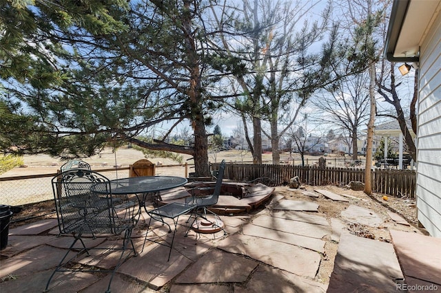 view of patio / terrace featuring outdoor dining space and fence