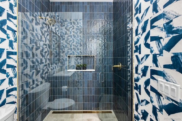 full bath with a shower stall and toilet