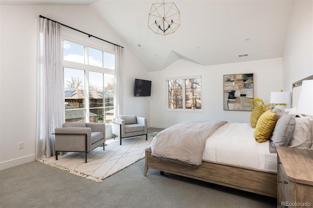 bedroom featuring multiple windows, high vaulted ceiling, carpet, and a chandelier