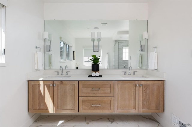 bathroom with visible vents, a sink, double vanity, and marble finish floor