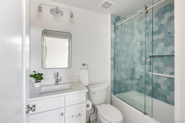 bathroom featuring visible vents, toilet, vanity, and enclosed tub / shower combo