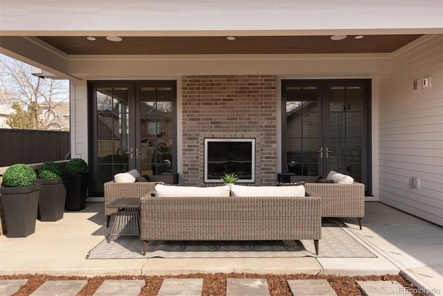 view of patio / terrace with french doors, an outdoor hangout area, and fence
