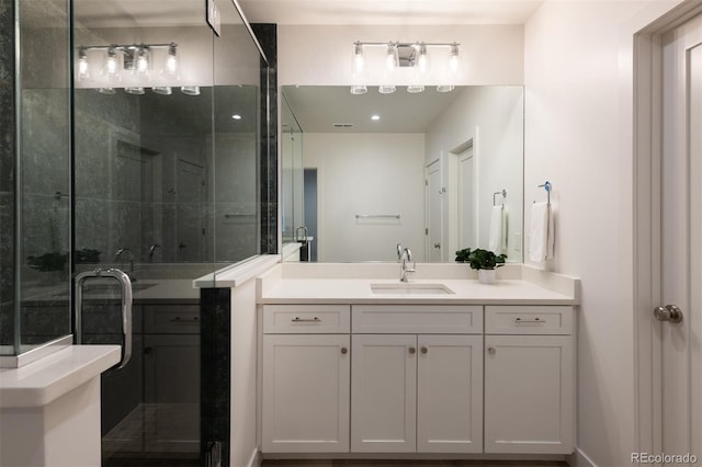 bathroom with vanity and a stall shower