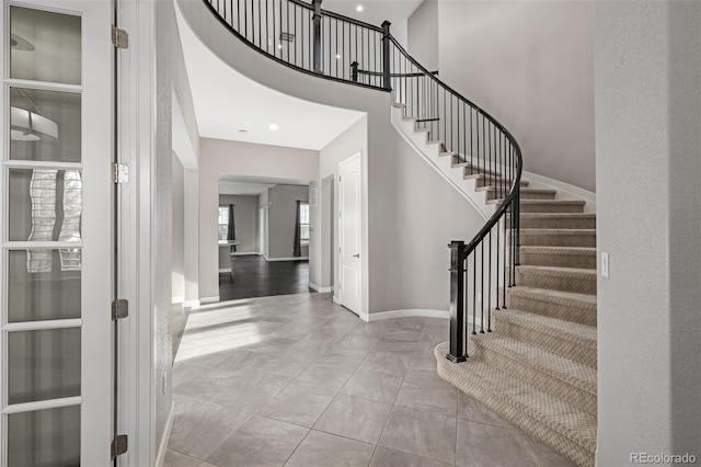 foyer entrance featuring a high ceiling