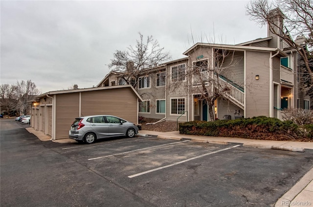 8416 Pebble Creek Way Unit 203, Highlands Ranch, CO 80126 - view of building exterior featuring uncovered parking