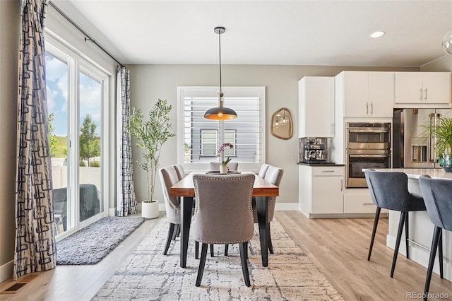 5680 Saddle Skirt St, Parker, CO 80134 - dining space featuring light wood finished floors and recessed lighting