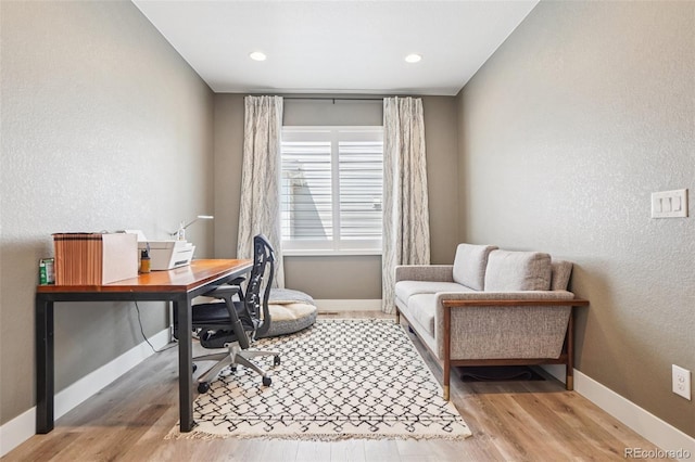 5680 Saddle Skirt St, Parker, CO 80134 - office area featuring wood finished floors and a textured wall