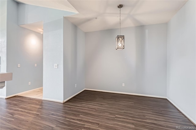 14251 E 1st Dr Unit 305, Aurora, CO 80011 - unfurnished dining area featuring wood finished floors and baseboards