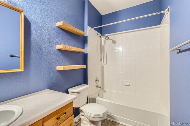14251 E 1st Dr Unit 305, Aurora, CO 80011 - bathroom featuring vanity, a textured wall, and shower / washtub combination