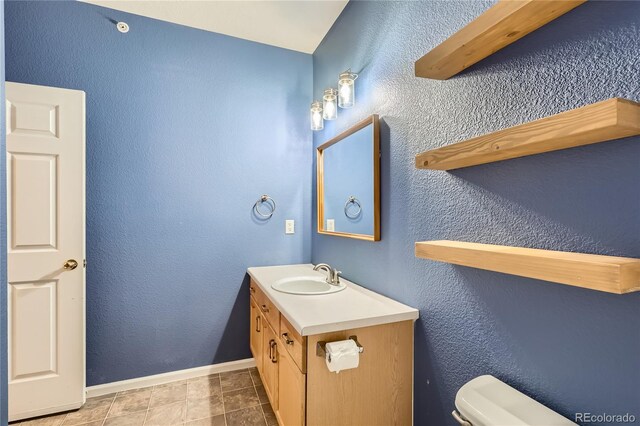 14251 E 1st Dr Unit 305, Aurora, CO 80011 - half bath featuring toilet and vanity