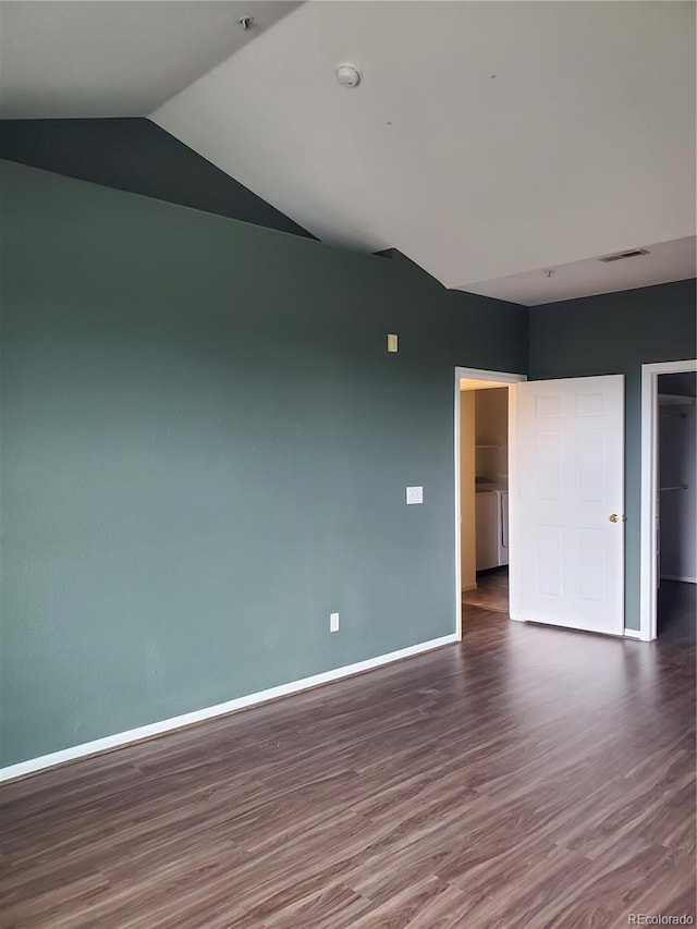 14251 E 1st Dr Unit 305, Aurora, CO 80011 - unfurnished bedroom with wood finished floors, lofted ceiling, and a closet