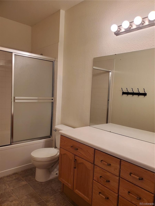 14251 E 1st Dr Unit 305, Aurora, CO 80011 - bathroom featuring vanity and bath / shower combo with glass door