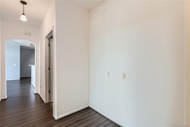 14251 E 1st Dr Unit 305, Aurora, CO 80011 - hallway featuring arched walkways and dark wood-style floors