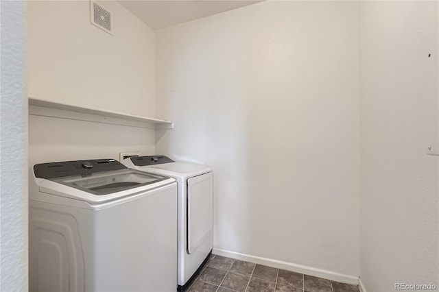 14251 E 1st Dr Unit 305, Aurora, CO 80011 - washroom featuring washer and clothes dryer and baseboards