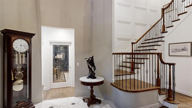 foyer entrance with light hardwood / wood-style floors