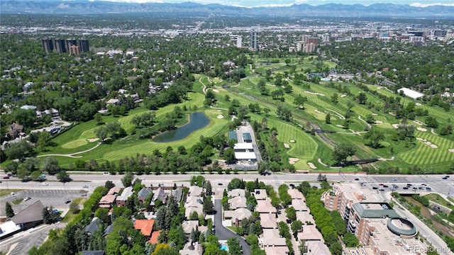 drone / aerial view featuring a water and mountain view