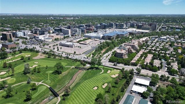 birds eye view of property with view of golf course