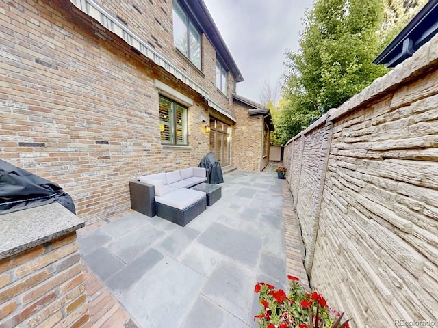 view of patio / terrace with a fenced backyard and an outdoor living space