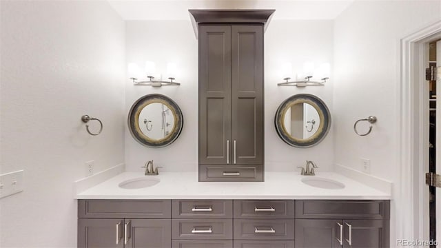 bathroom featuring double vanity and a sink