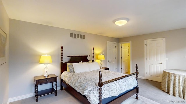 bedroom featuring light carpet, visible vents, and baseboards