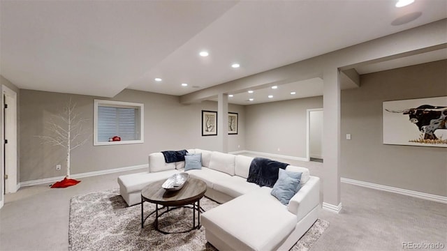 living room featuring recessed lighting, baseboards, and light colored carpet