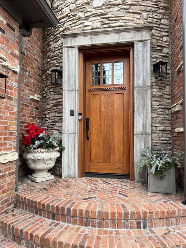 view of exterior entry with stone siding