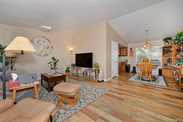 2242 Stepping Stones Way, Colorado Springs, CO 80904 - living room featuring light wood-style floors, lofted ceiling, and baseboards