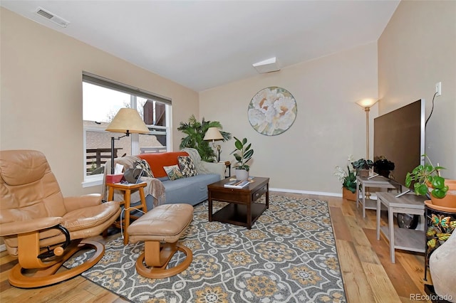 2242 Stepping Stones Way, Colorado Springs, CO 80904 - living area featuring hardwood / wood-style flooring and baseboards