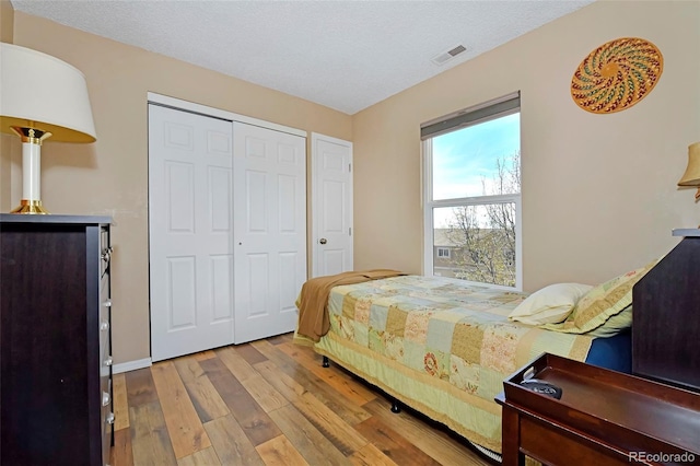 2242 Stepping Stones Way, Colorado Springs, CO 80904 - bedroom with wood-type flooring, a closet, and baseboards