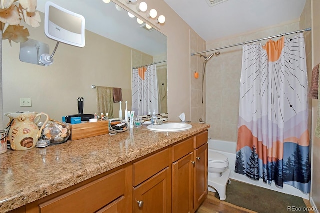 2242 Stepping Stones Way, Colorado Springs, CO 80904 - full bathroom with wood finished floors, vanity, shower / tub combo, and toilet