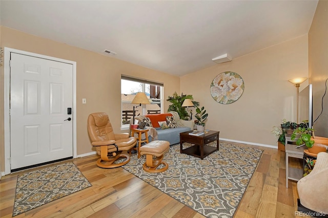 2242 Stepping Stones Way, Colorado Springs, CO 80904 - living area with wood-type flooring and baseboards