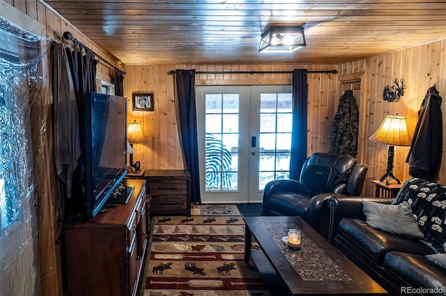 living area with wooden ceiling, wood walls, and french doors