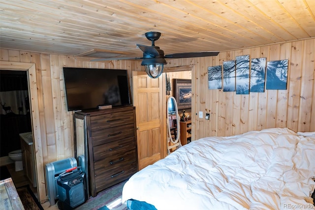 bedroom with wooden ceiling and wood walls