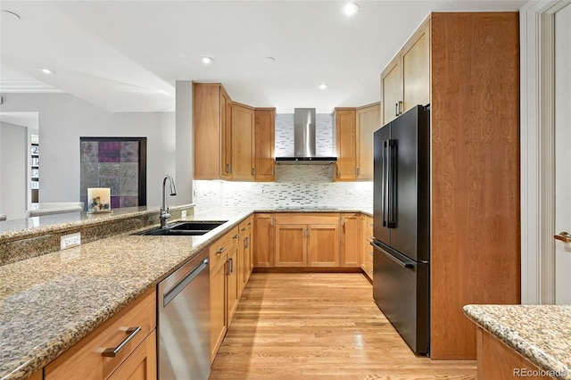 2400 E Cherry Creek S Drive 307, Denver, CO 80209 - kitchen featuring wall chimney exhaust hood, freestanding refrigerator, stainless steel dishwasher, light wood-style floors, and light stone countertops