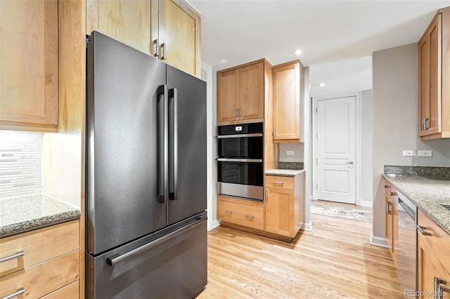 2400 E Cherry Creek S Drive 307, Denver, CO 80209 - kitchen with appliances with stainless steel finishes, light wood-type flooring, light brown cabinetry, light stone counters, and recessed lighting
