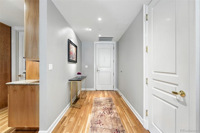 2400 E Cherry Creek S Drive 307, Denver, CO 80209 - doorway to outside with light wood finished floors and recessed lighting